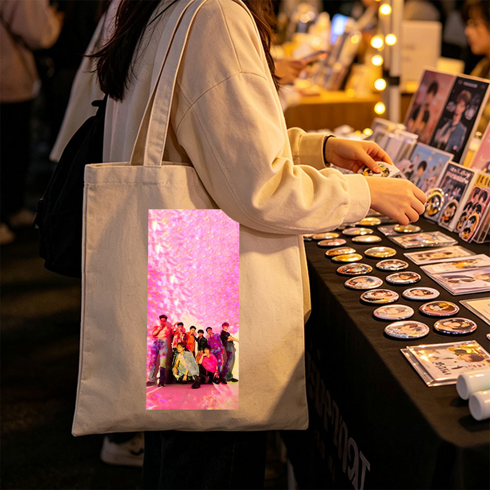 SEVENTEEN in a vibrant pink-lit scene with dynamic poses and colorful outfits - Canvas tote bags