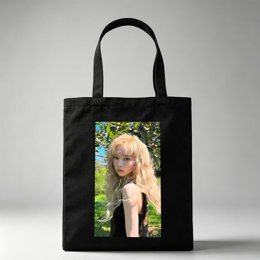 Kim Yoo Jung in a Sunlit Garden with Flowing Blonde Hair and Elegant Black Dress - Canvas tote bags