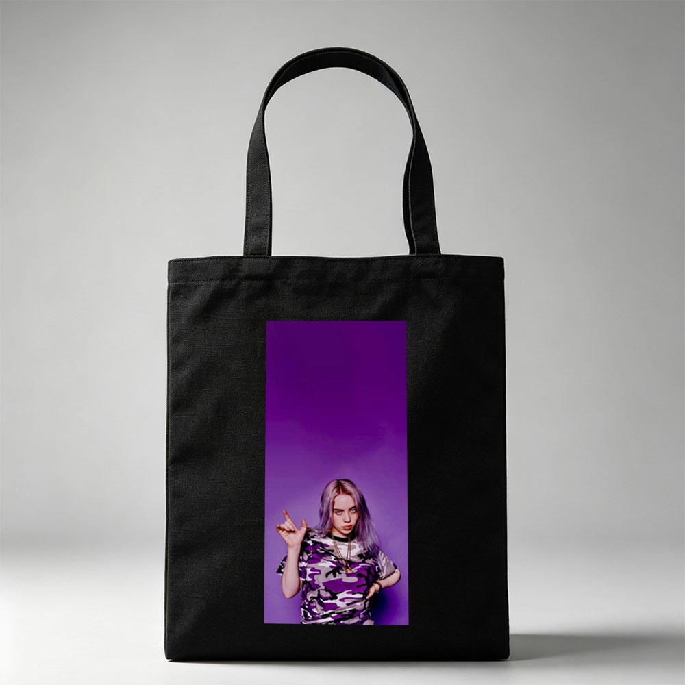 Billie Eilish in Purple Camo Outfit Making Hand Gesture Against Vibrant Background - Canvas tote bags