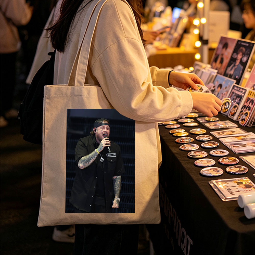 Cody Johnson Performing on Stage with Microphone and Tattooed Arms - Canvas tote bags