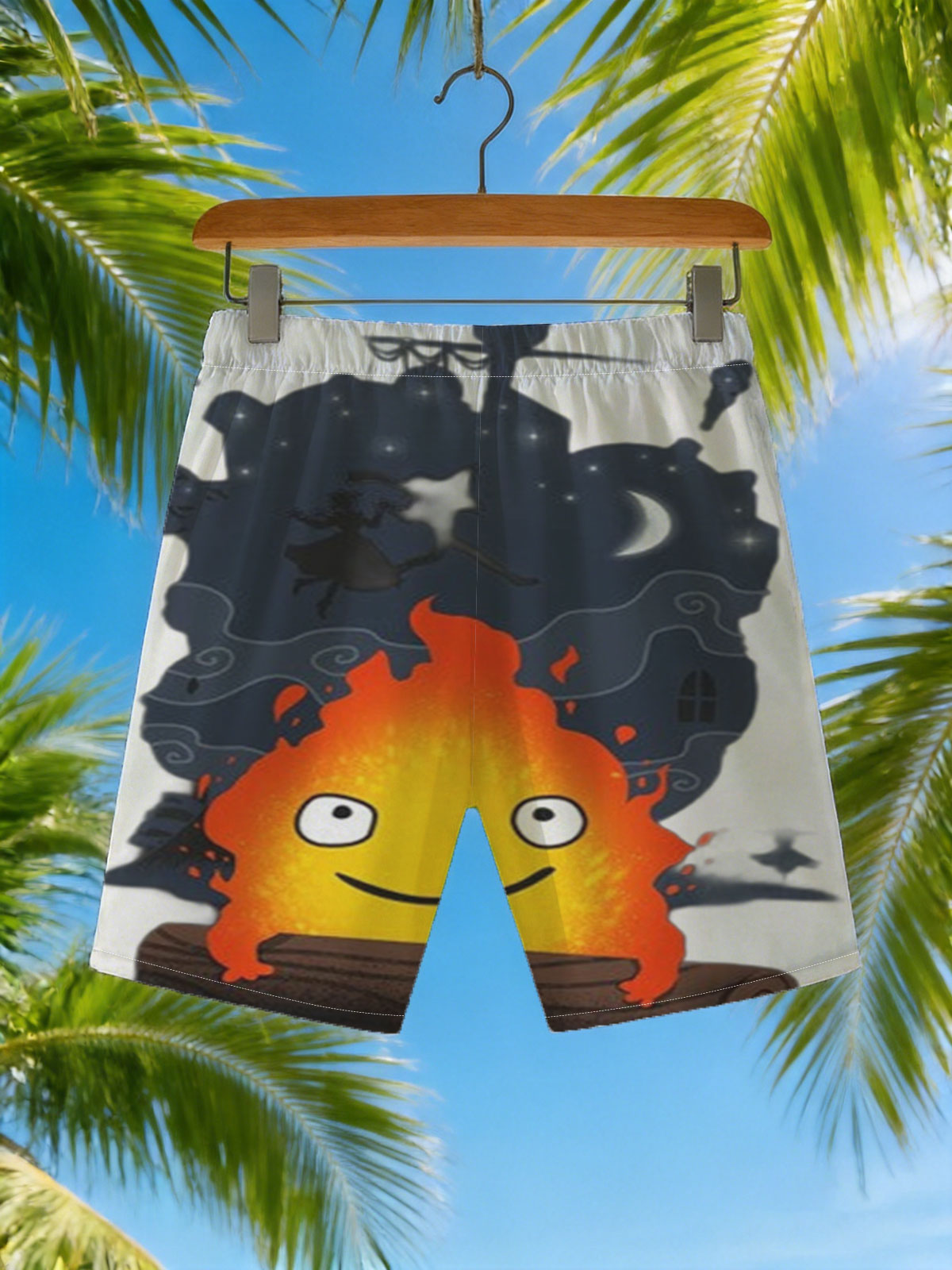 Cute Flame Character with Night Sky and Witch Silhouette Background -  Beach shorts
