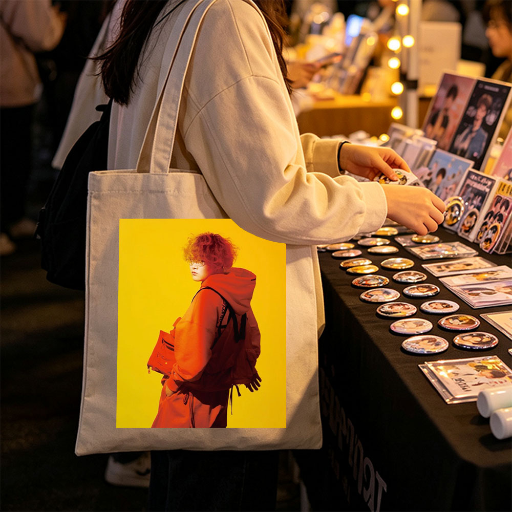 Yuta from Exile Tribe in a Bold Orange Outfit with a Backpack Against a Vibrant Yellow Background - Canvas tote bags