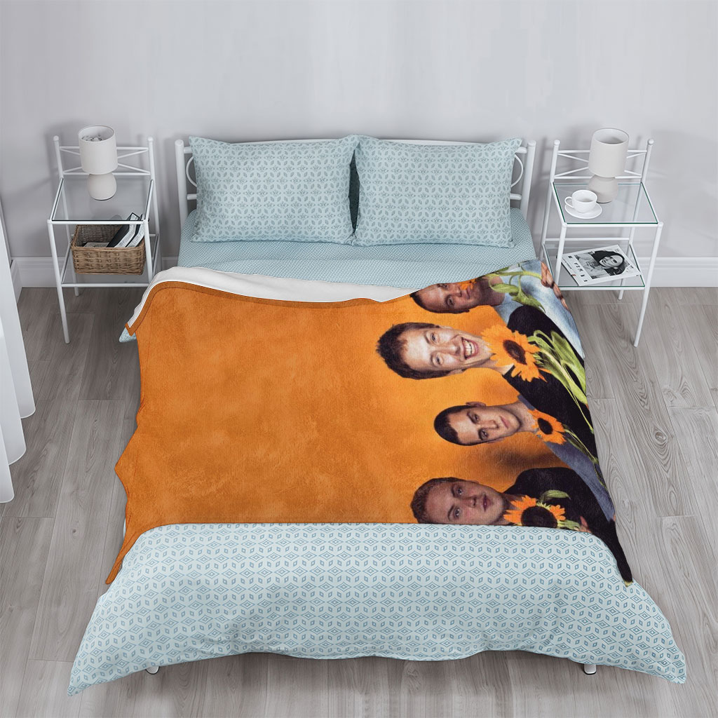 Imagine Dragons Band Members Holding Sunflowers Against Orange Background - Blankets