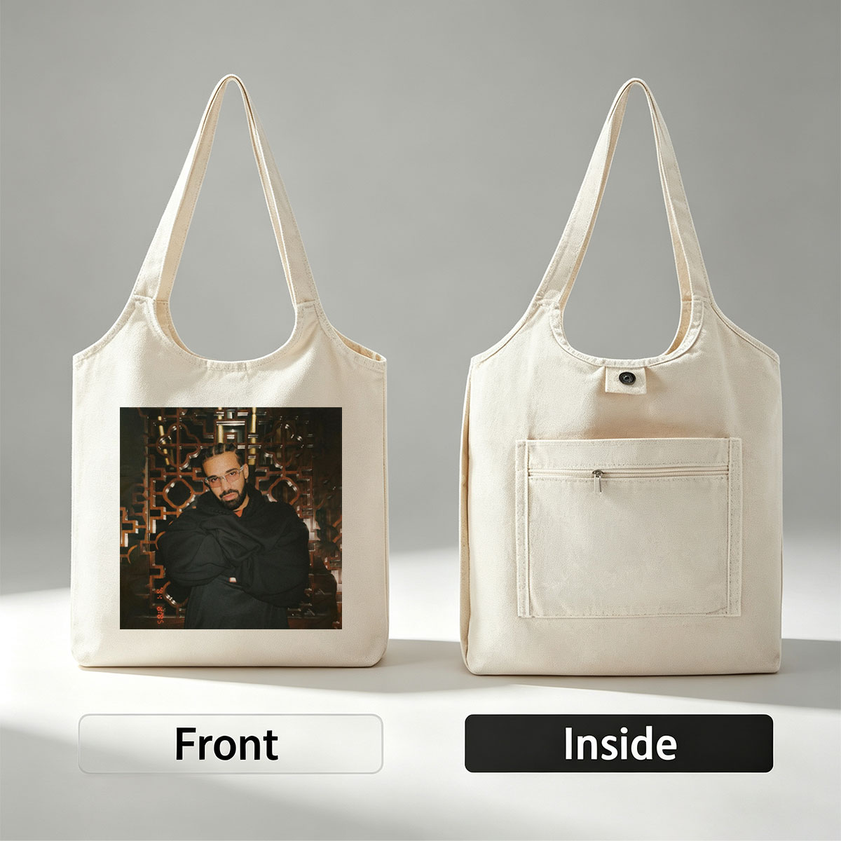 Drake in a Stylish Pose Against an Ornate Background Wearing Glasses and a Black Hoodie - Canvas shoulder bags/