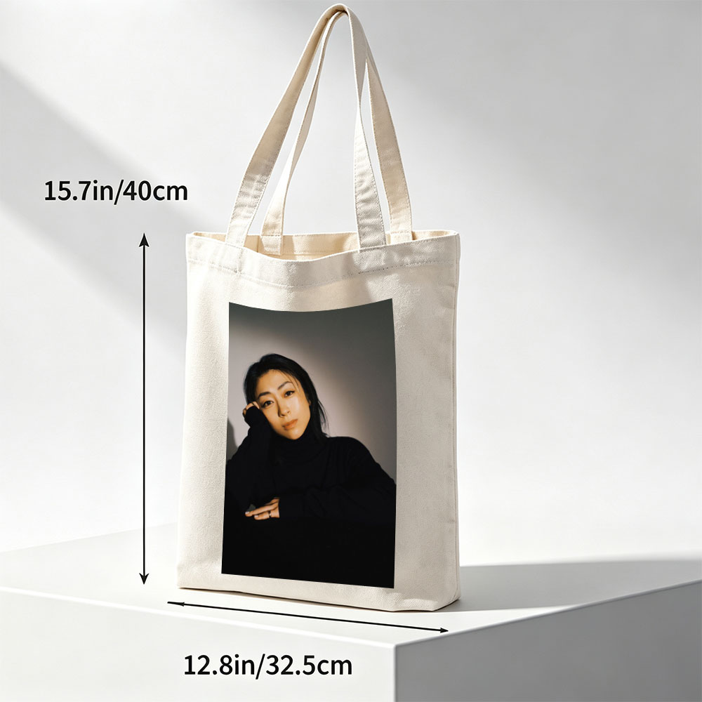 Yoko Kanno in a Moody Portrait Wearing Black Turtleneck with Dramatic Lighting - Canvas tote bags
