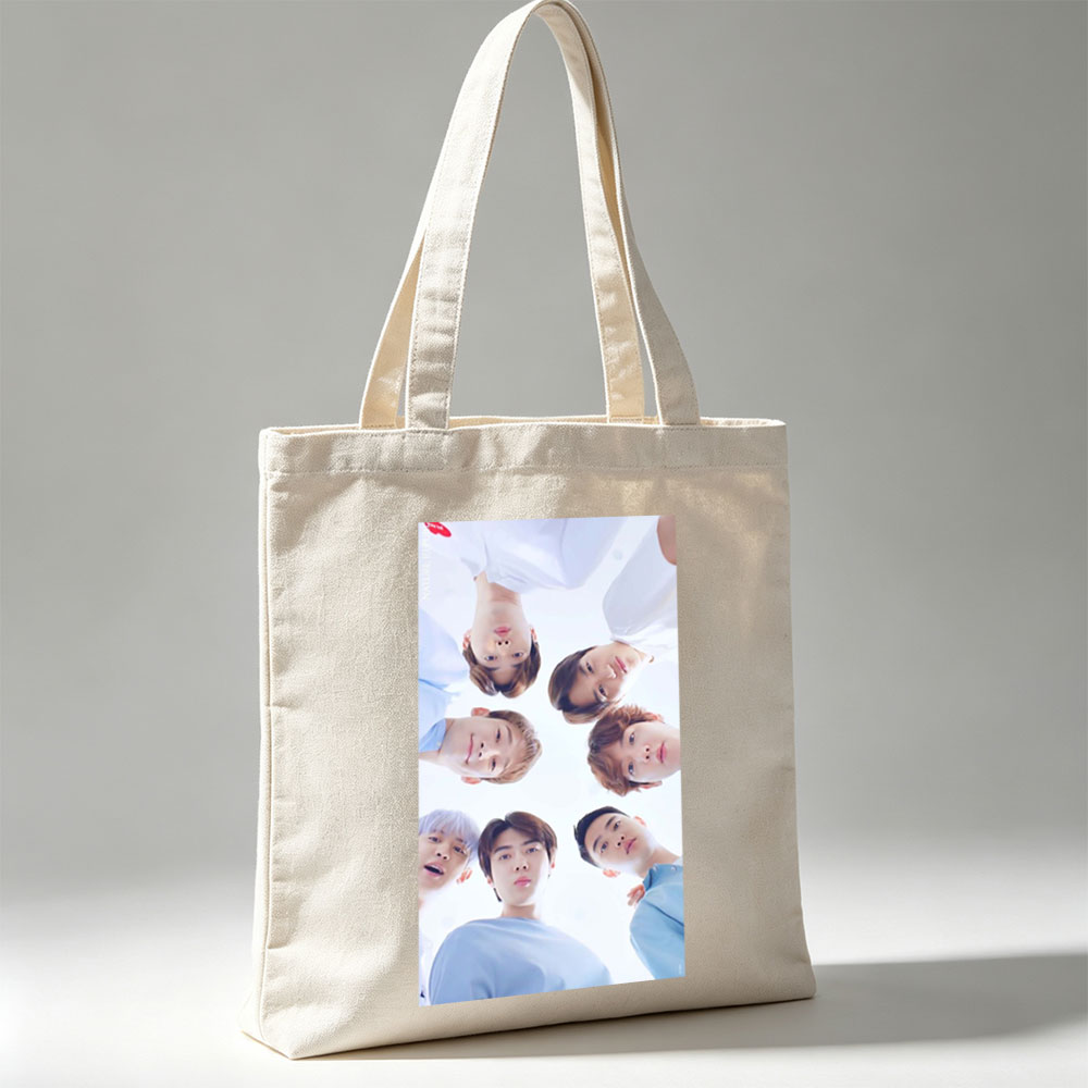 NCT Dream Members in a Circular Formation Wearing Light Blue Outfits Against a Bright Sky Background - Canvas tote bags
