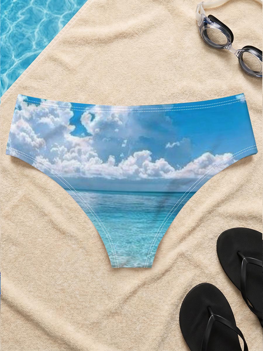 Crystal clear turquoise waters meet soft sandy beach under a vibrant blue sky with fluffy white clouds. -  Men's swim trunks