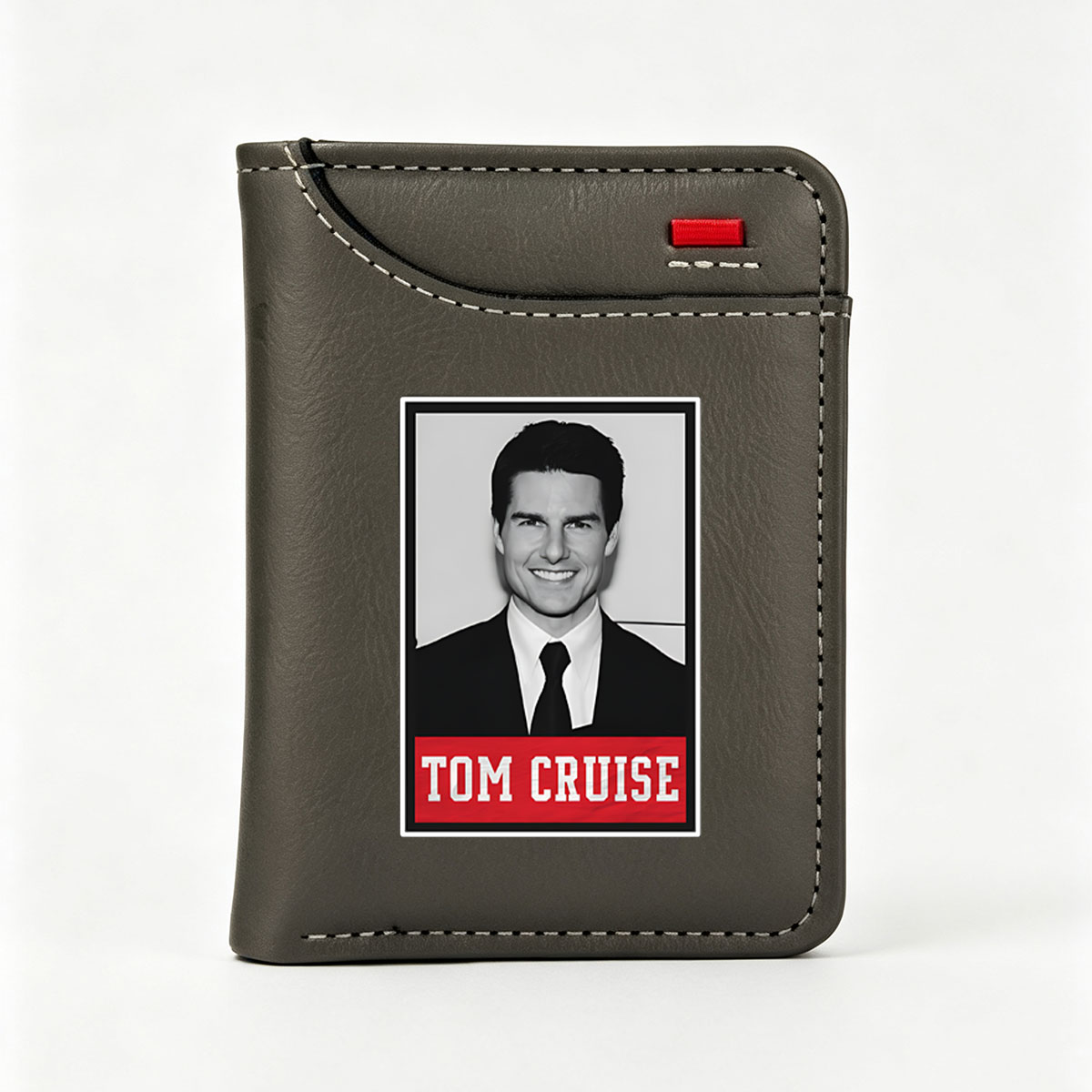Tom Cruise in a formal suit and tie, smiling confidently. - Vertical Style Wallet