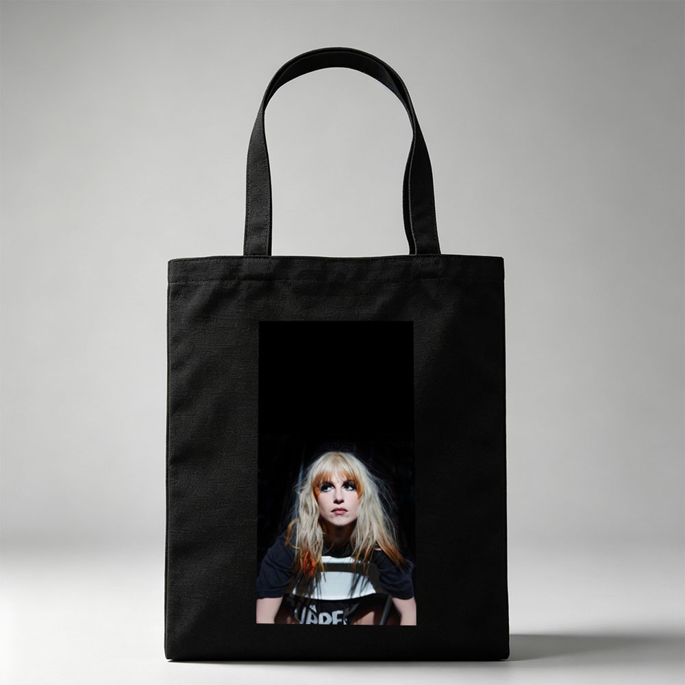 Hayley Williams in a Dramatic Portrait with Intense Gaze and Blonde Hair Against Dark Background - Canvas tote bags