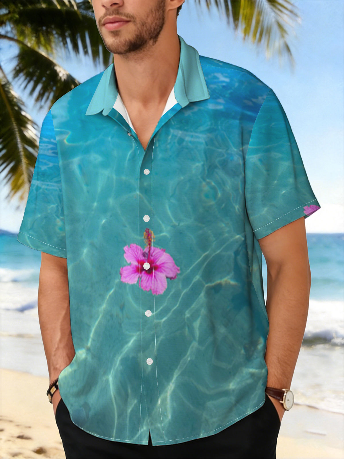 Pink hibiscus floating on crystal clear turquoise water -  Shirt