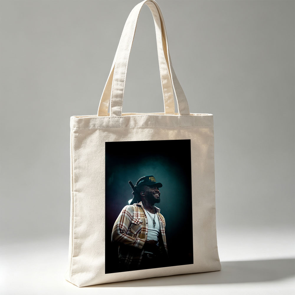 Burna Boy on Stage Performing with a Smile in a Plaid Shirt and Cap - Canvas tote bags