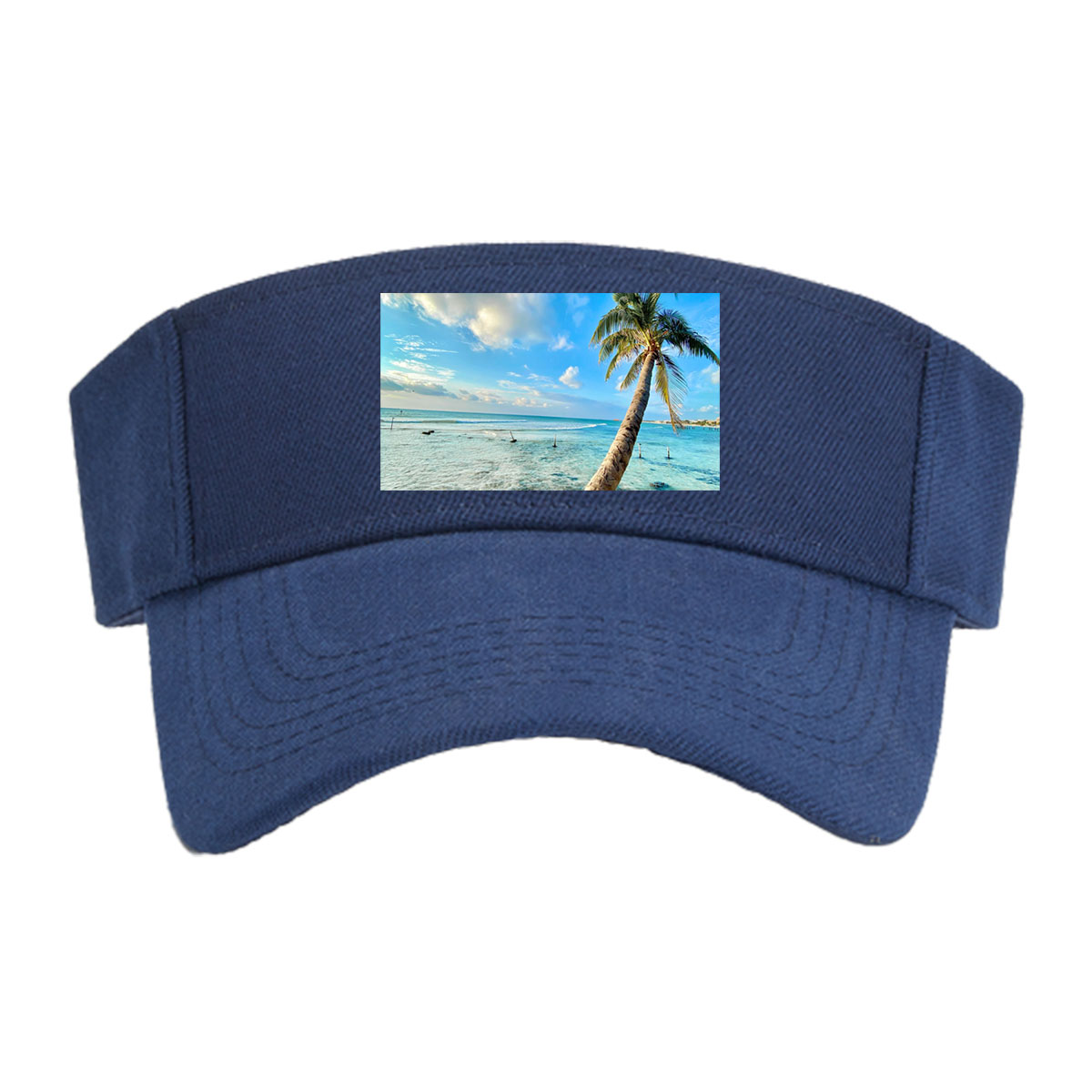 Tropical beach with palm tree leaning over clear blue water under a bright sky. -  Visor cap