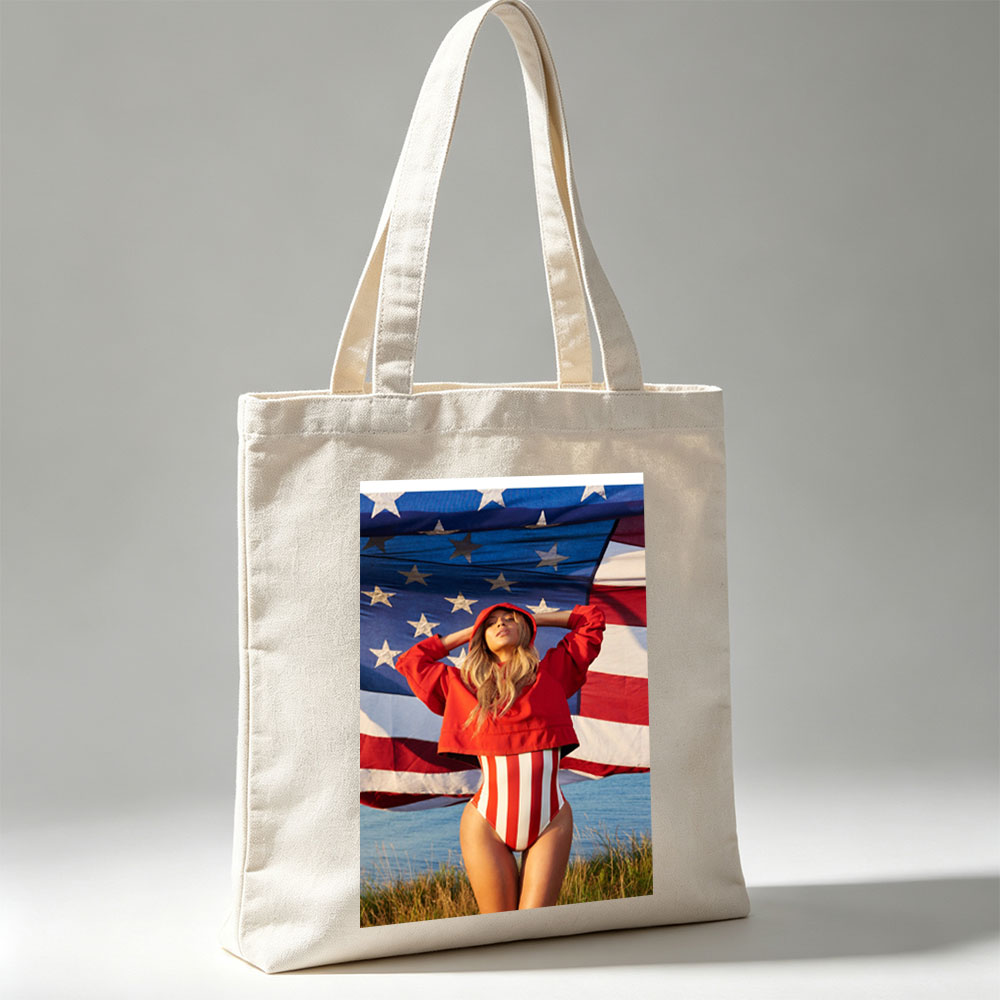 Beyonce in Red Hoodie and Striped Bodysuit Standing Before American Flag by the Beach - Canvas tote bags