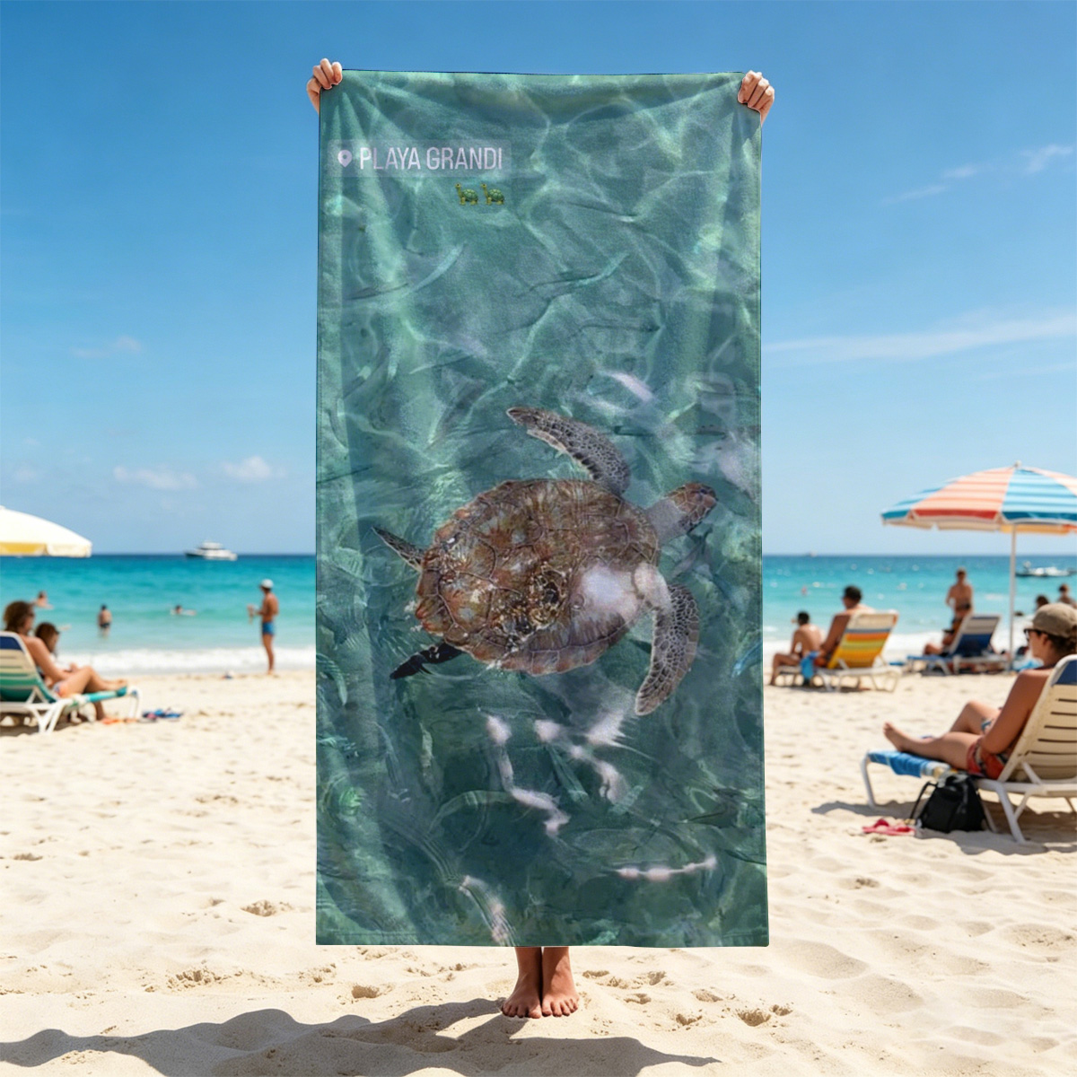 Sea turtle swims gracefully in clear turquoise waters at Playa Grandi. - Beach towels