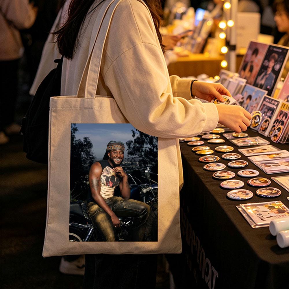 Terry Crews on Motorcycle with City View in Background - Canvas tote bags