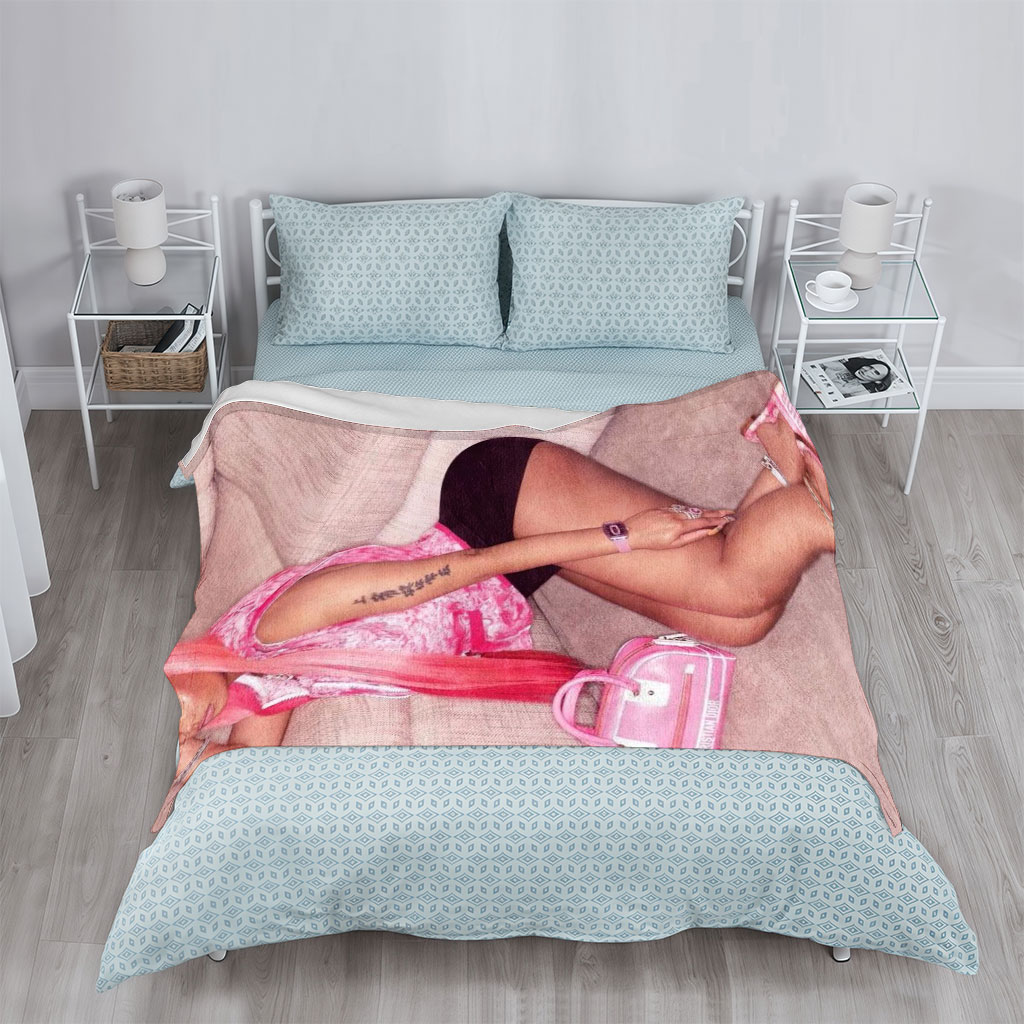 Nicki Minaj Sitting on Couch in Pink Outfit with Matching Accessories - Blankets
