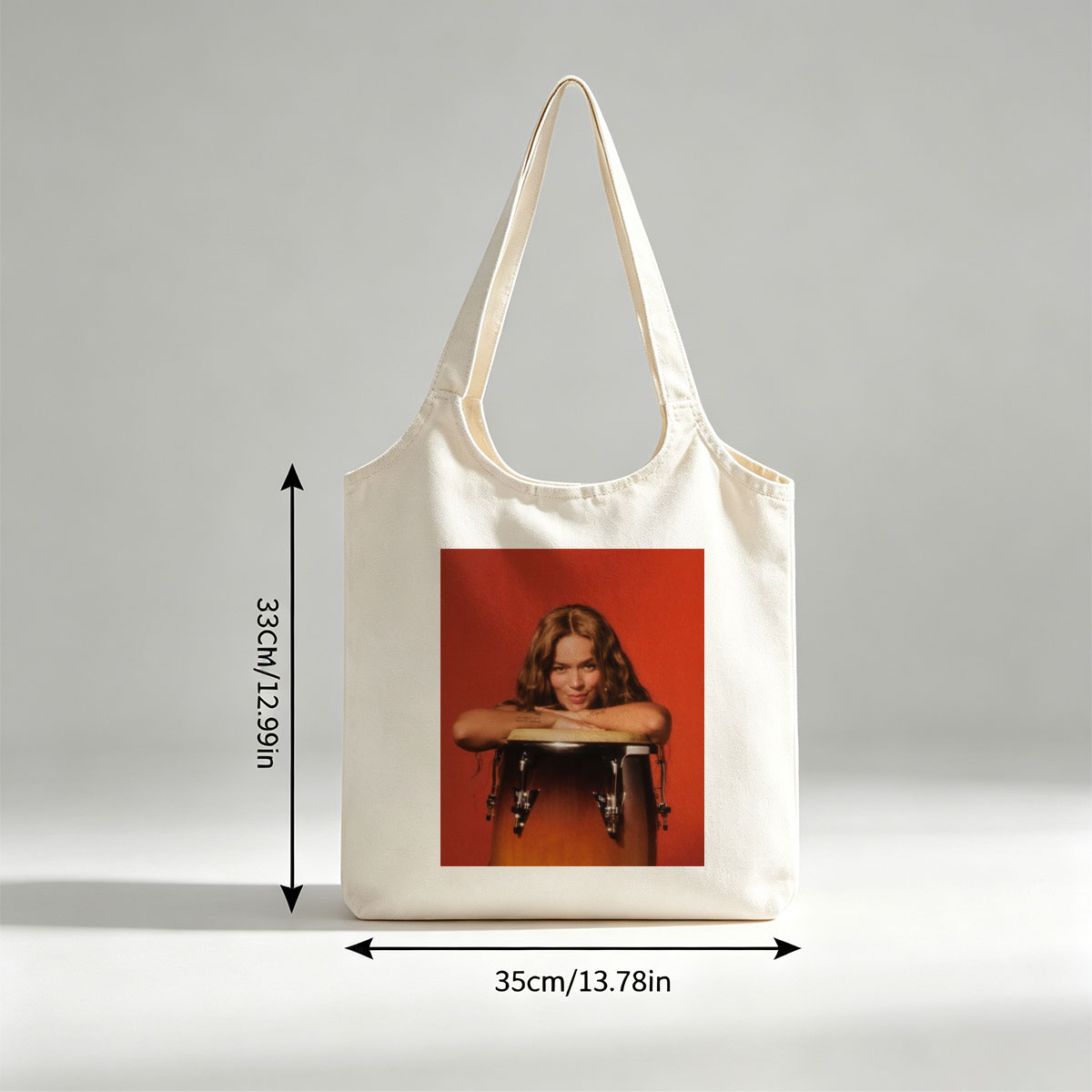 Maren Morris Leaning on a Conga Drum Against a Red Background - Canvas shoulder bags/