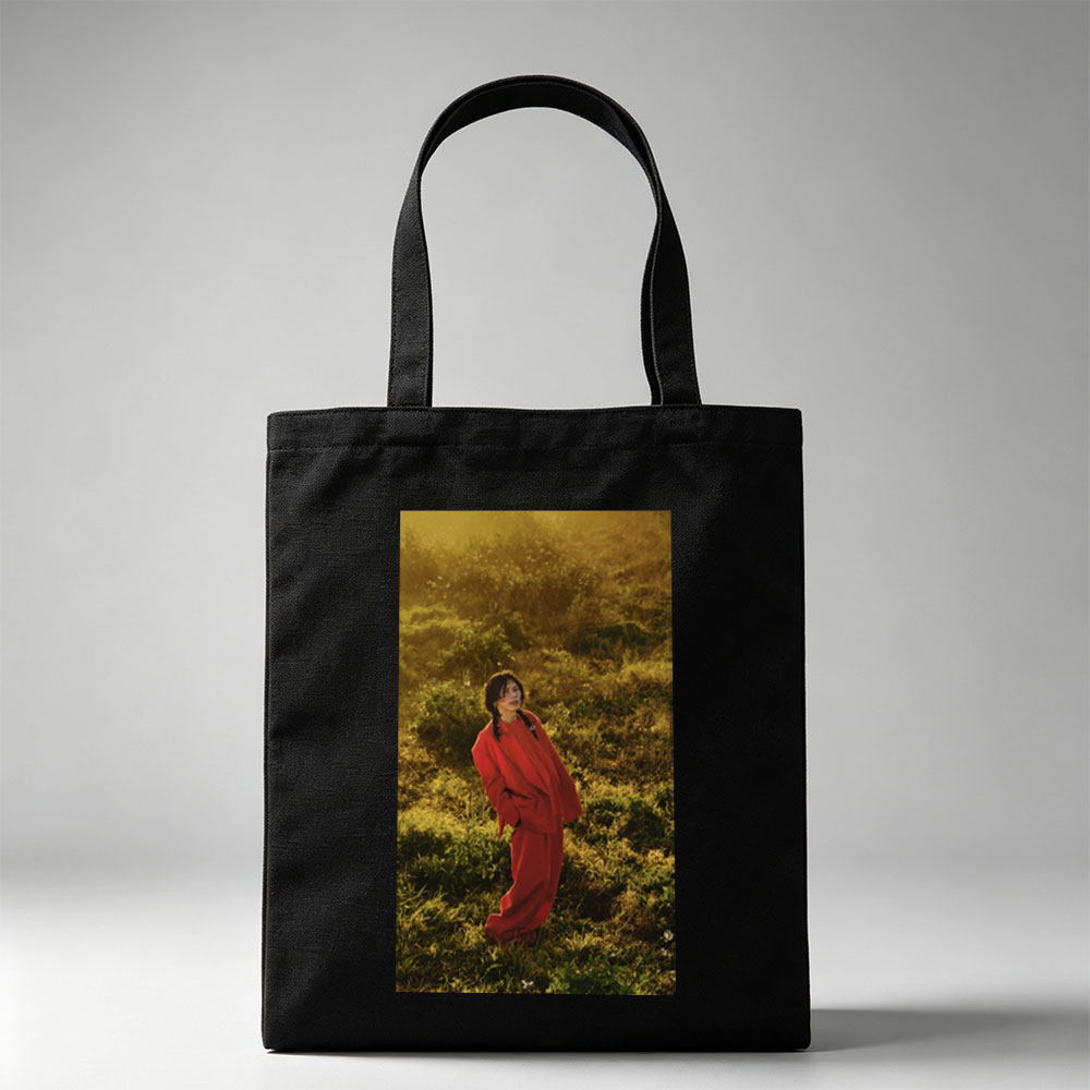 Billie Eilish in a Field Wearing a Red Outfit at Sunset - Canvas tote bags