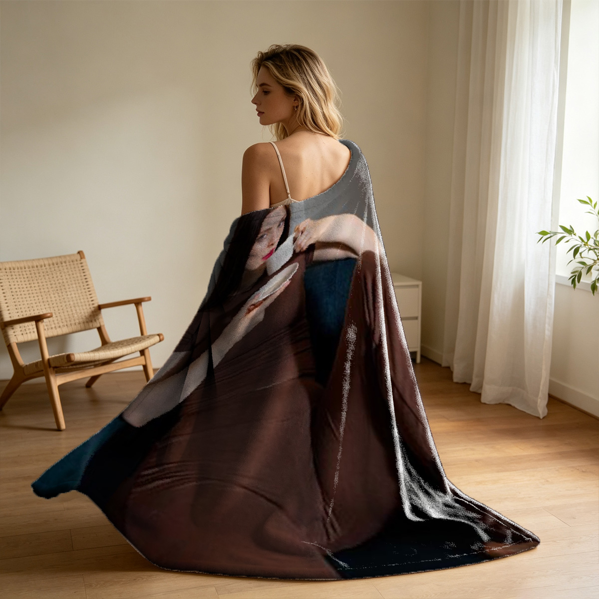 Emily Ratajkowski in sheer black dress on blue sofa - Blanket