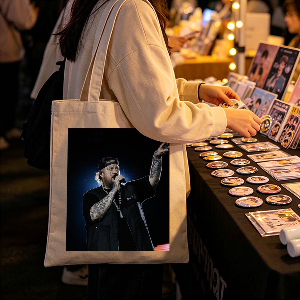 Jelly Roll Performing on Stage with Microphone and Tattooed Arms - Canvas tote bags