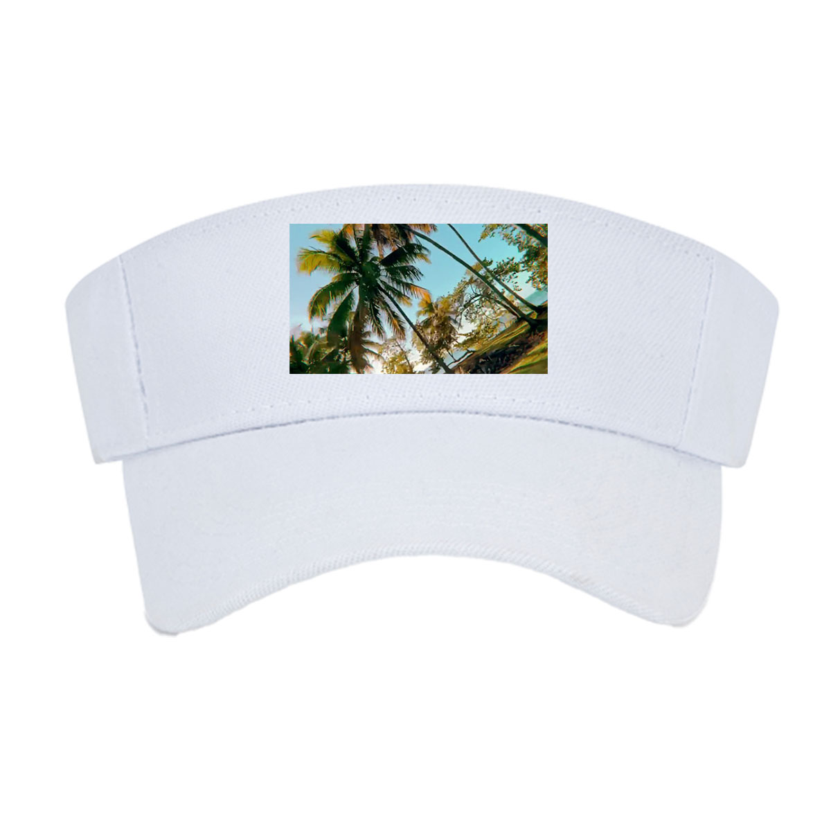 Tropical palm trees sway under a clear blue sky, casting golden shadows on the ground. -  Visor cap