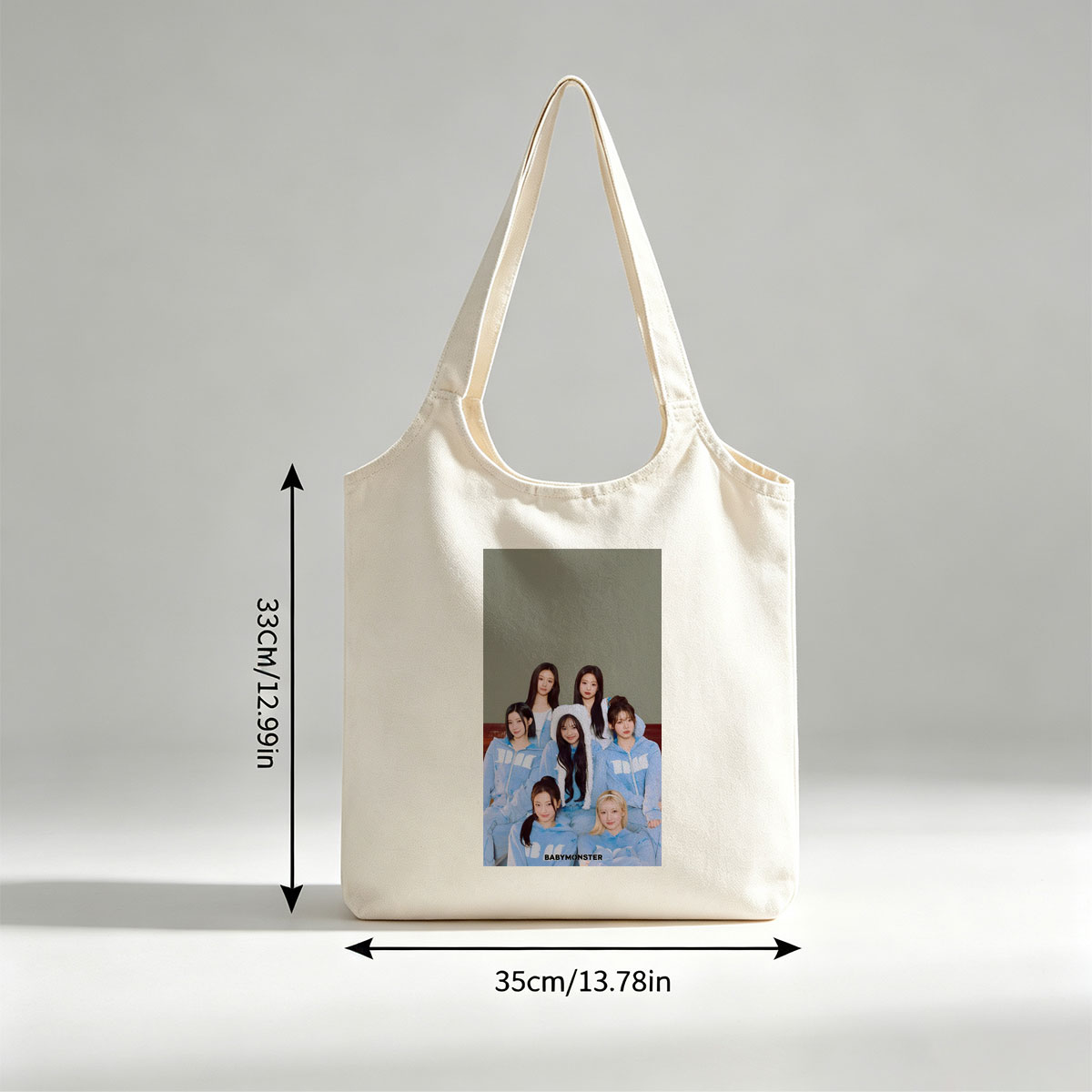 BABYMONSTER Group Photo in Matching Blue Outfits with Furry Hoodies and Minimalist Background - Canvas shoulder bags/