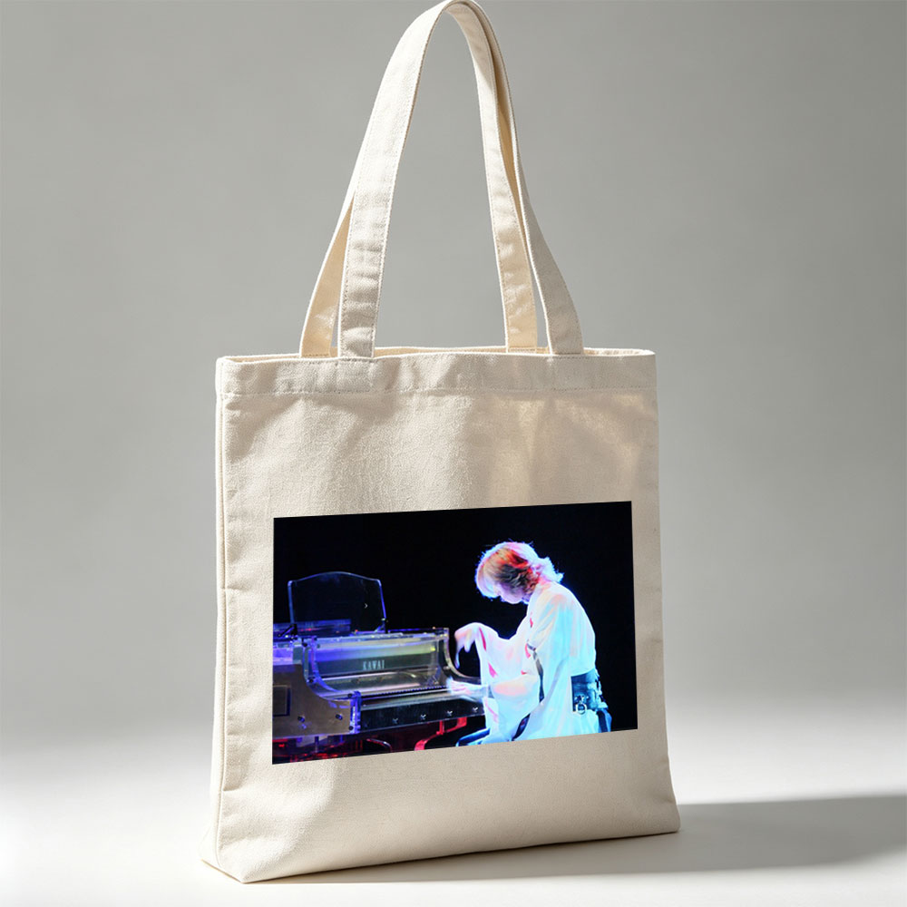 Yuki Kajiura Performing Piano on Stage with Dramatic Lighting - Canvas tote bags