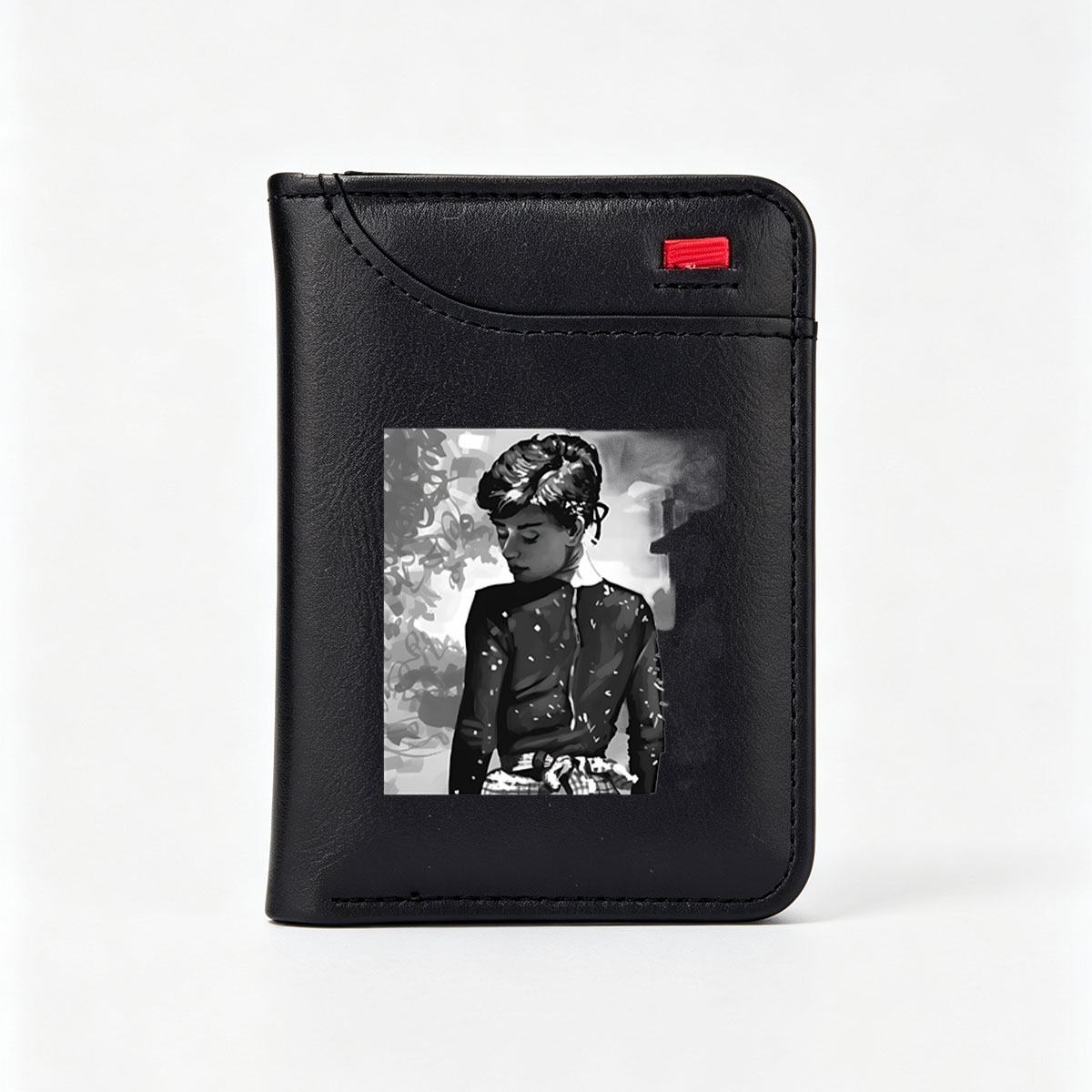 Audrey Hepburn in a contemplative moment, classic black and white portrait - Vertical Style Wallet