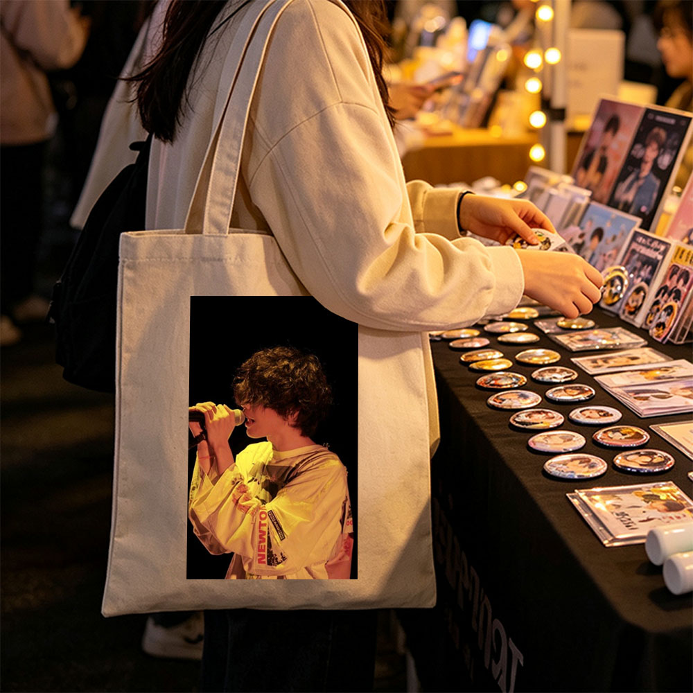 Harry Styles Singing on Stage in a Yellow Outfit with Microphone - Canvas tote bags