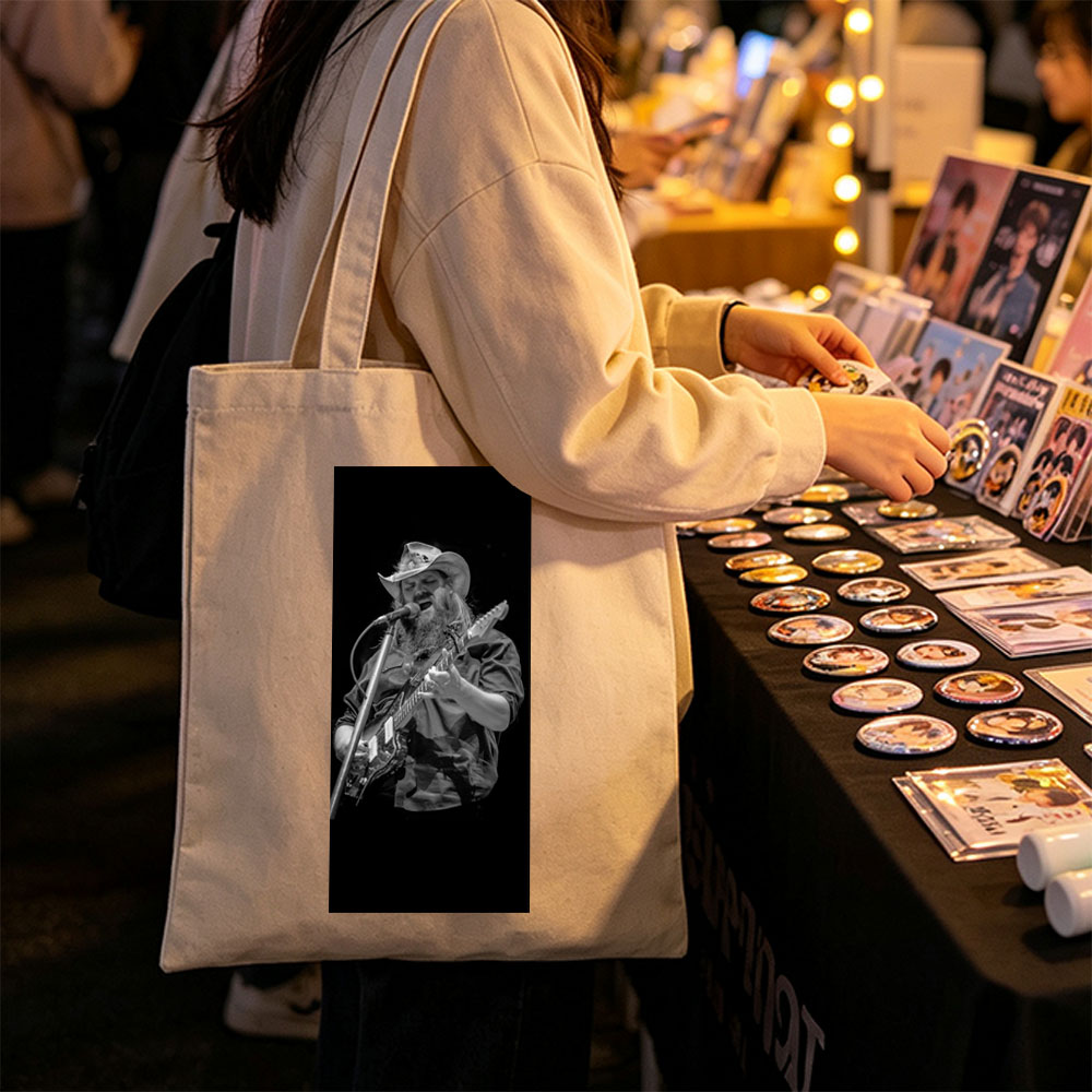 Chris Stapleton Performing Live with Guitar and Microphone on Stage - Canvas tote bags