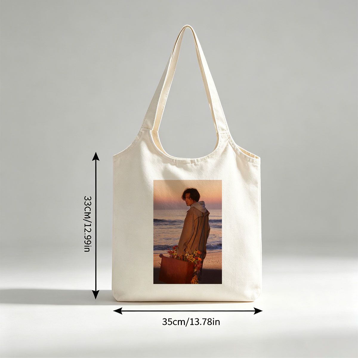 Takuya Kimura on Beach at Sunset Holding Flower-Adorned Suitcase - Canvas shoulder bags/