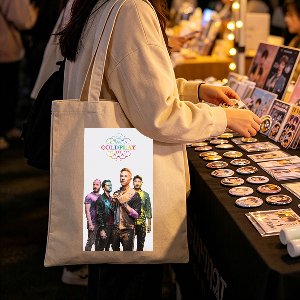 Coldplay Band Members in Colorful Painted Outfits Standing Together with Rainbow Logo Above - Canvas tote bags