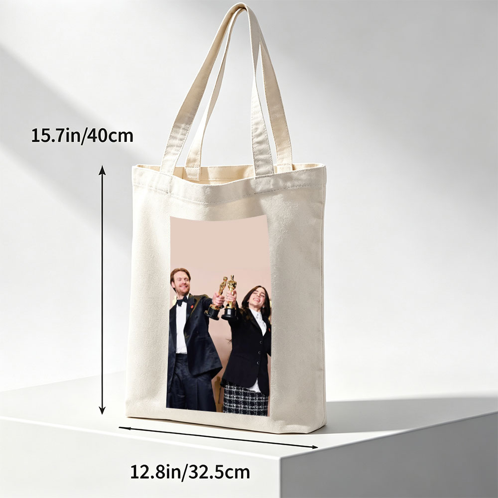Emma Stone and Damien Chazelle Holding Oscars at the Academy Awards Ceremony - Canvas tote bags
