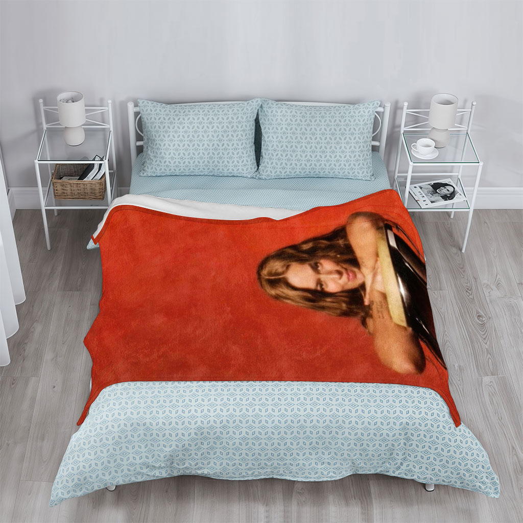 Rita Ora Leaning on a Drum Against a Red Background - Blankets