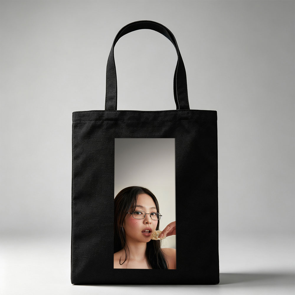 Jennie Kim Eating a Dumpling in a Minimalist Portrait - Canvas tote bags