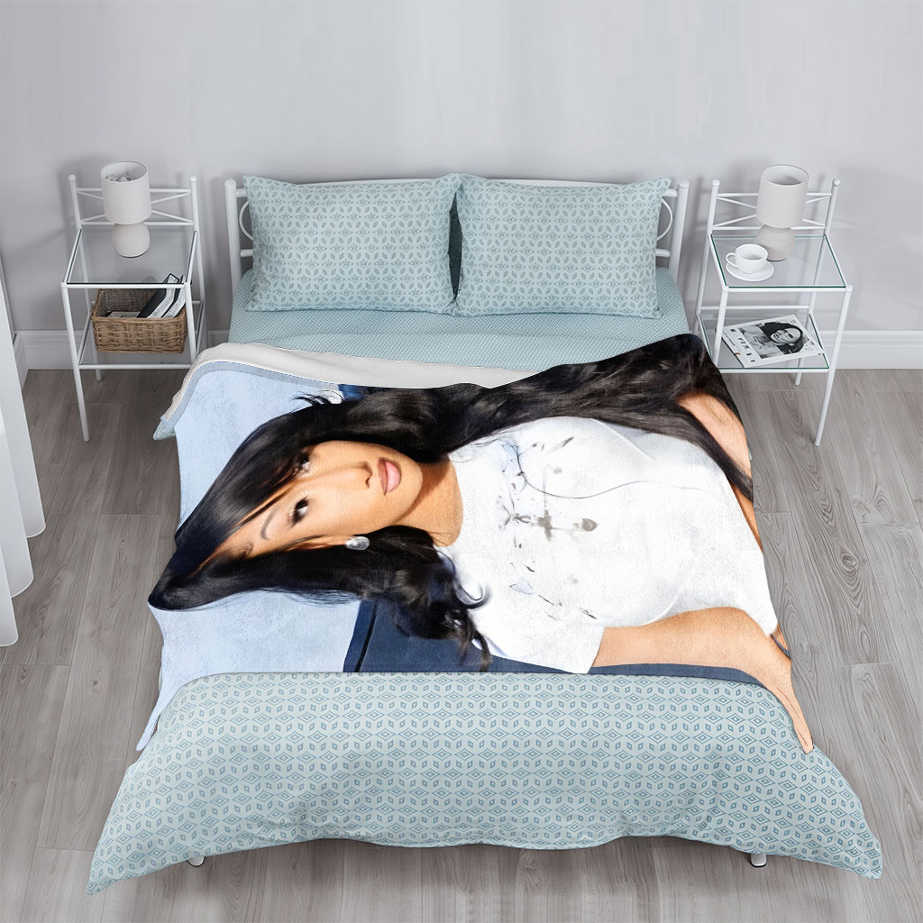 Nicki Minaj in a Stylish White Crop Top with Long Black Hair and Bold Makeup - Blankets