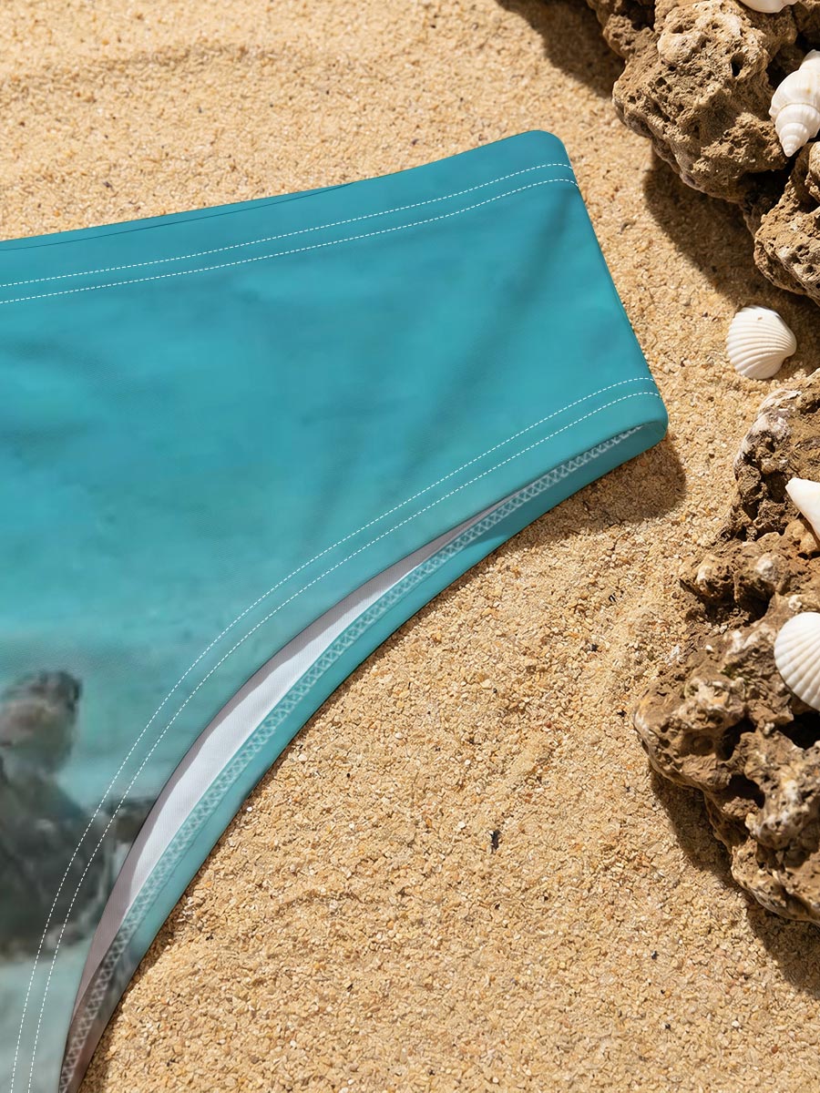 Sea turtle swimming in clear blue water over sandy ocean floor -  Men's swim trunks