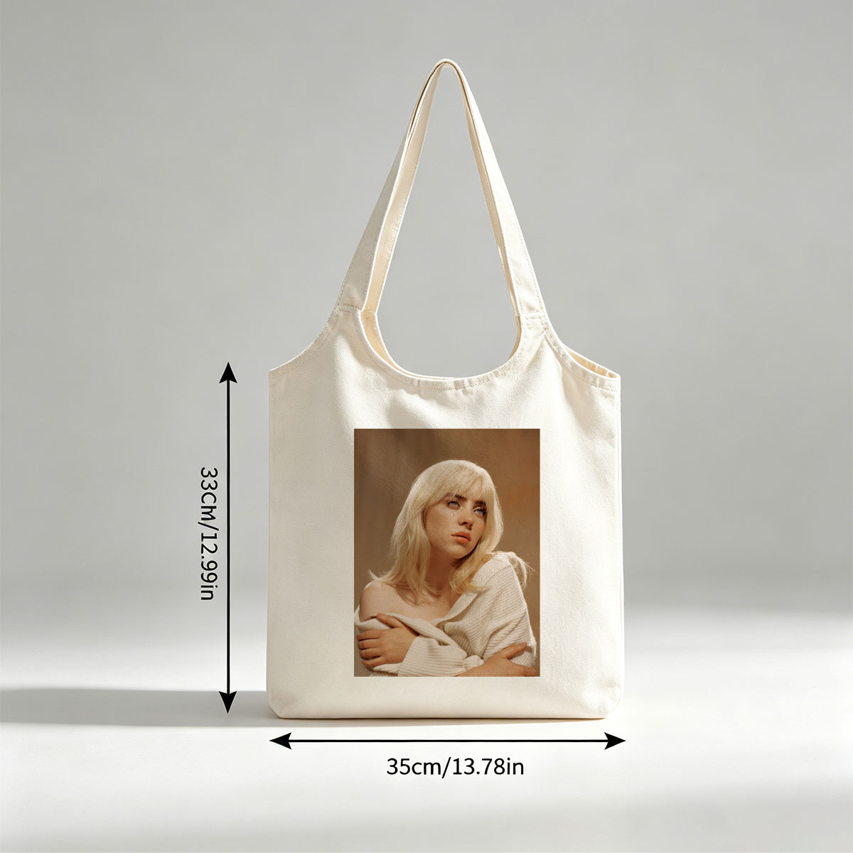 Billie Eilish in a Soft Portrait Wearing a White Off-Shoulder Sweater with Blonde Hair and Blue Eyes - Canvas shoulder bags/