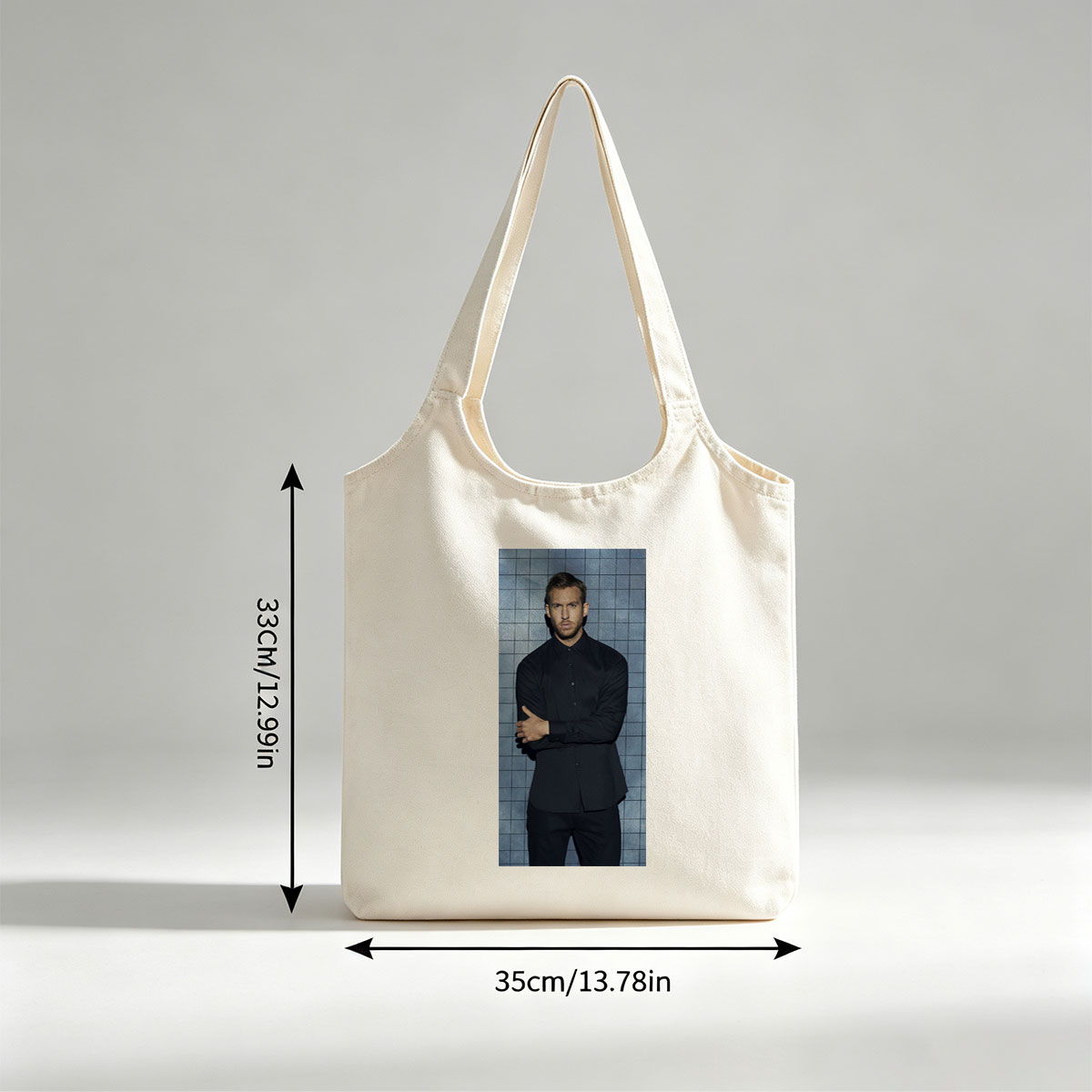 Calvin Harris in a Black Shirt and Pants Standing Against a Blue Tiled Wall with Arms Crossed - Canvas shoulder bags/