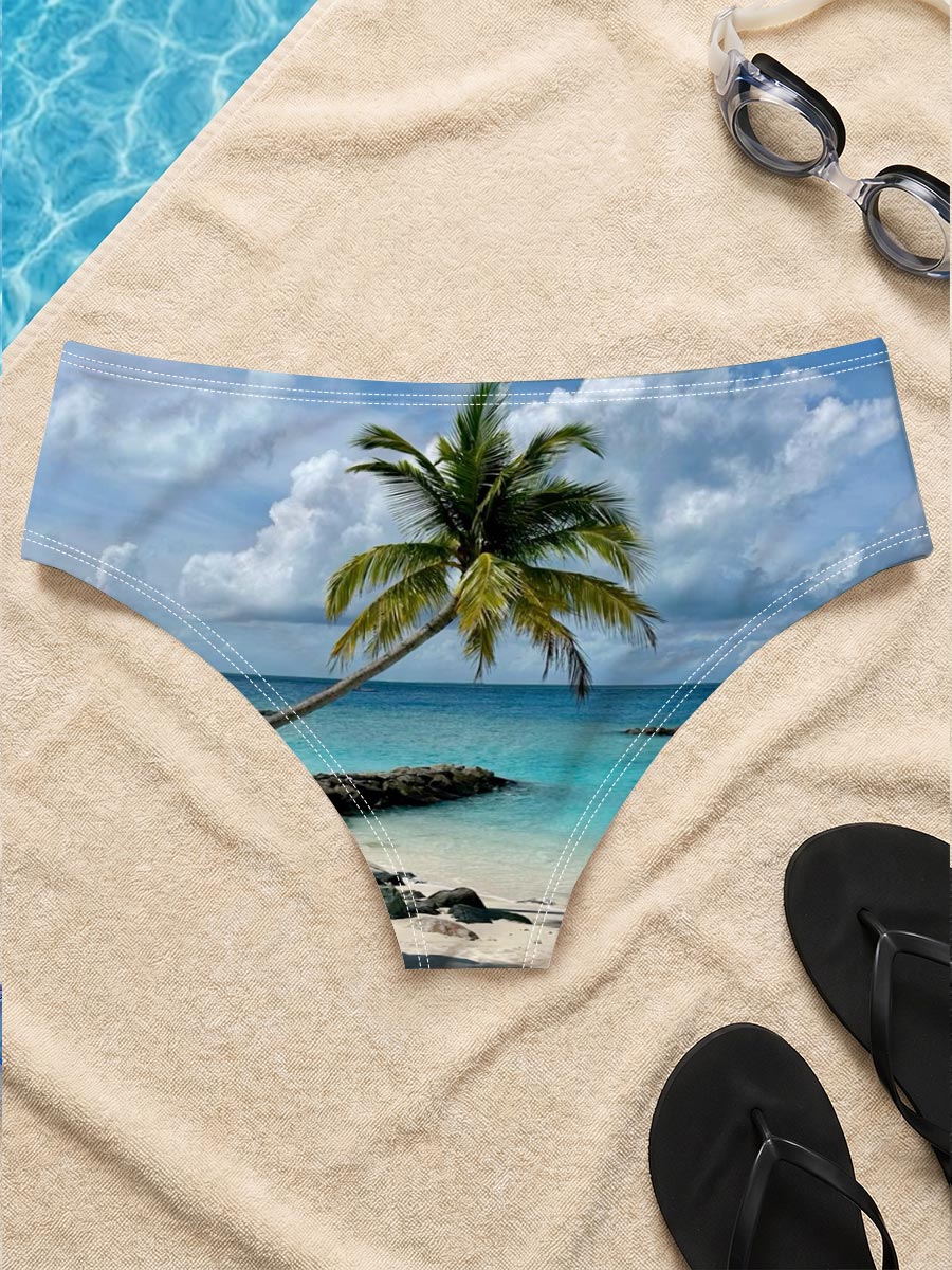 Tropical beach with palm tree leaning over turquoise water and white sand under blue sky. -  Men's swim trunks