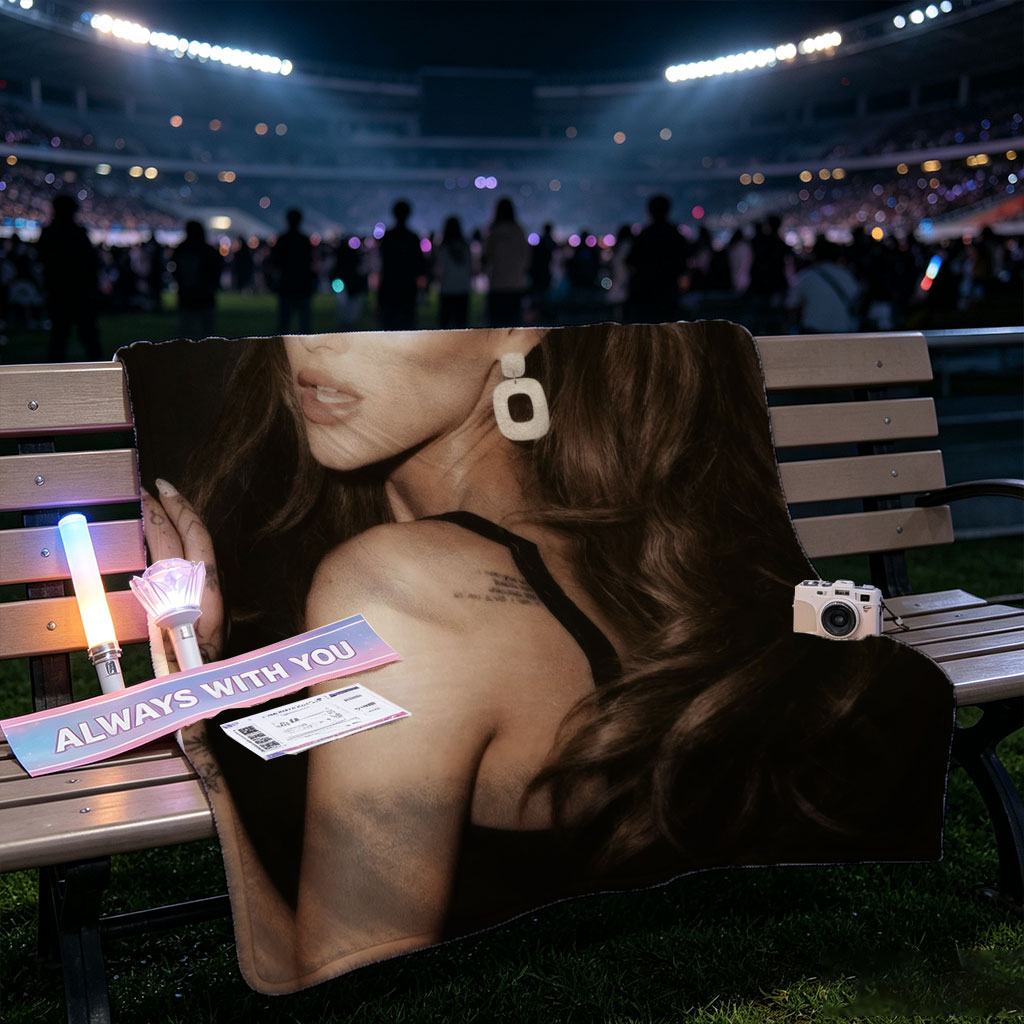 Ariana Grande in a Dramatic Pose with Long Hair and Tattoos on Dark Background - Blankets