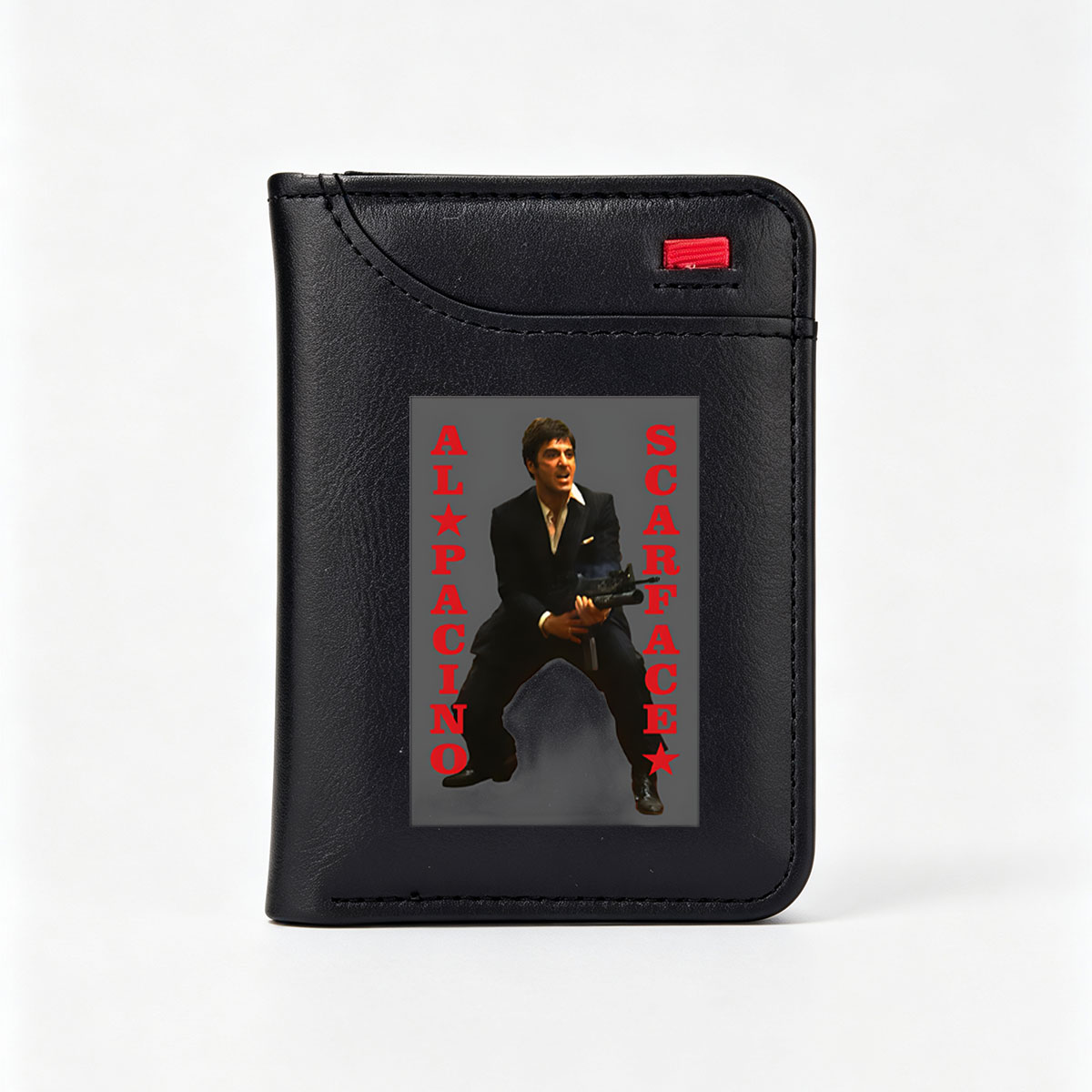 Al Pacino as Scarface, iconic gangster film character, holding a machine gun in a dramatic pose. - Vertical Style Wallet