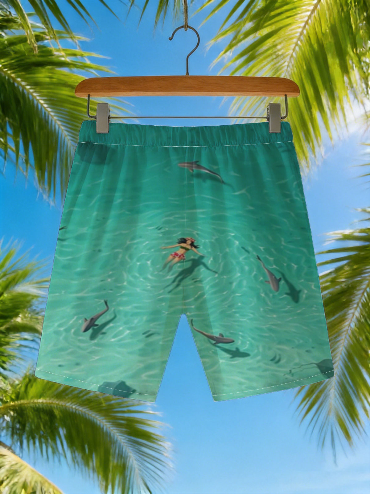 Woman swimming with sharks in clear turquoise water -  Beach shorts