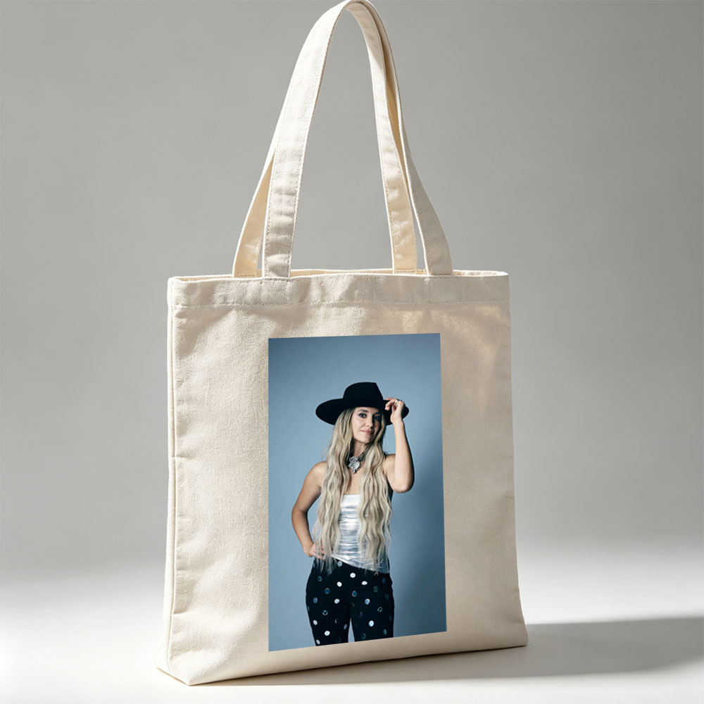 Shania Twain in a Stylish Pose Wearing a Black Hat and Polka Dot Pants - Canvas tote bags