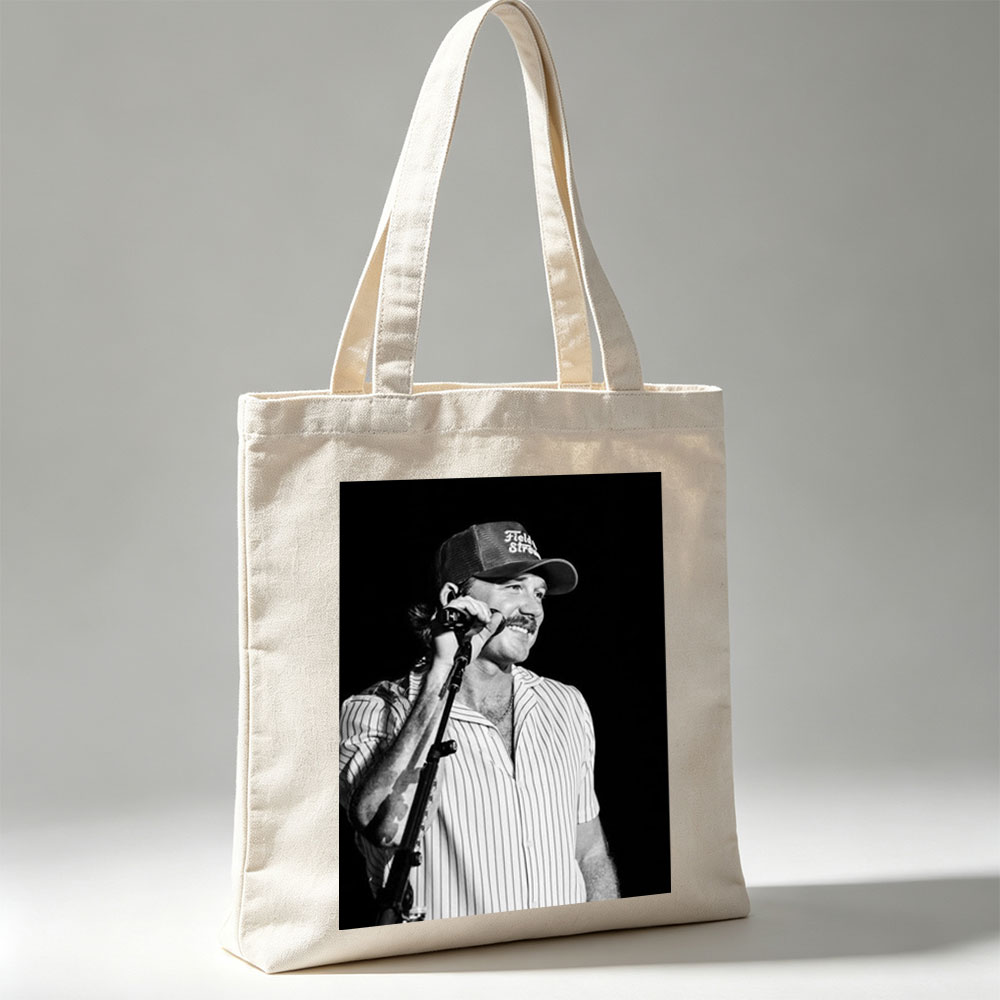 Ronnie Milsap Performing on Stage with Microphone in Black and White Photo - Canvas tote bags