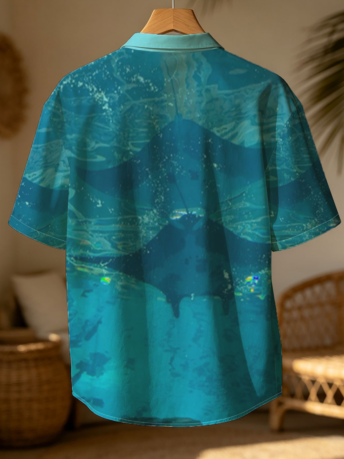 Graceful manta rays glide through clear blue waters, their silhouettes dancing beneath the surface. -  Shirt