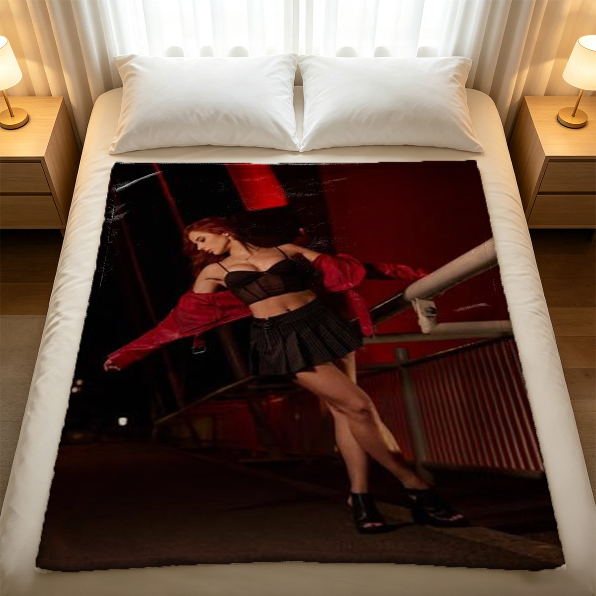 Emma Watson in black fishnet bodysuit and cardigan kneeling on bed. - Blanket