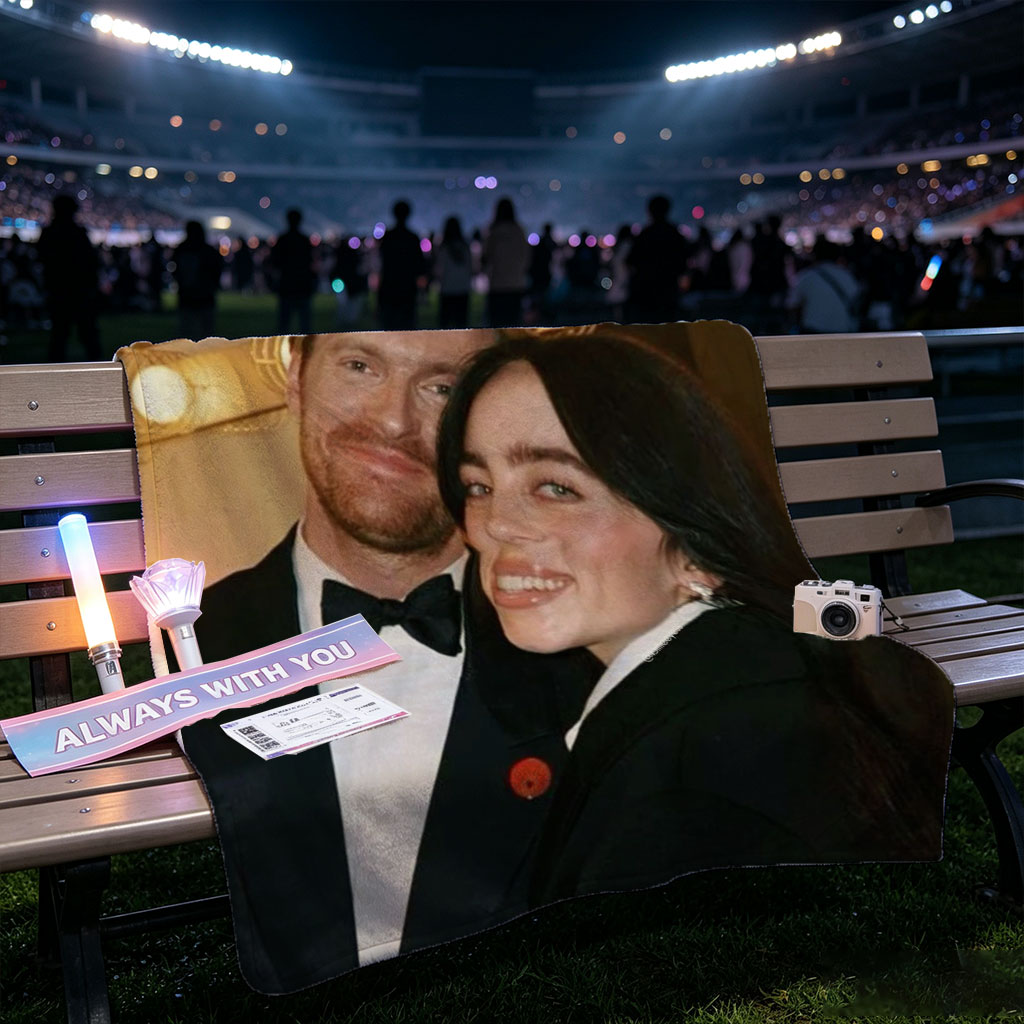 Lily Collins and Sam Claflin at a glamorous event, smiling together in formal attire with warm lighting in the background. - Blankets