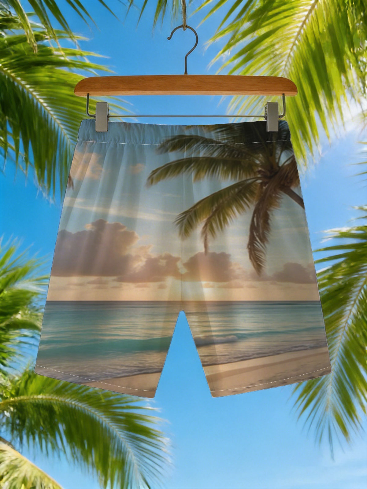 Sunset on a tropical beach with palm trees and calm ocean waves. -  Beach shorts