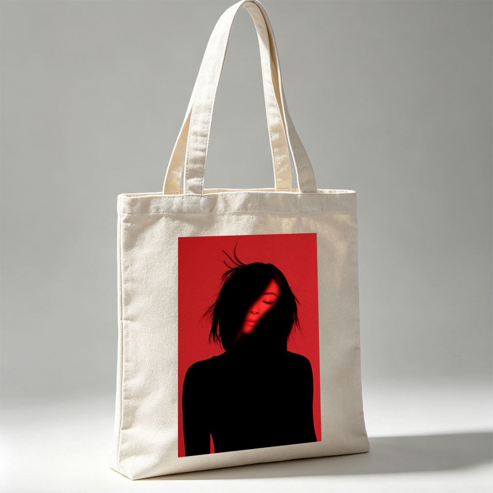 Billie Eilish in a Dramatic Red-Lit Portrait with Silhouetted Features - Canvas tote bags